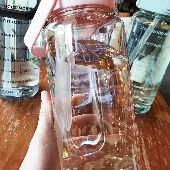 Gym accessory: 2L portable water bottle with straw & motivational time markers for consistent hydration.