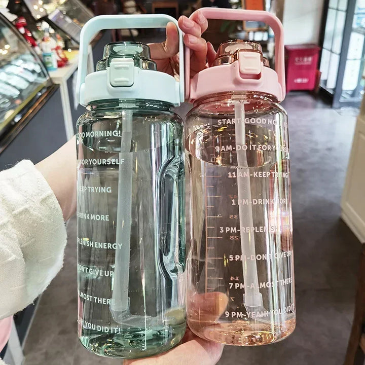 Drink more with this 2L portable straw bottle, featuring time markers for tracking water intake.