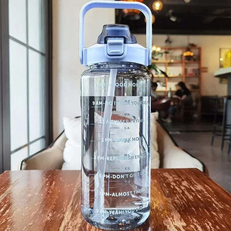 Hydrating 2L water bottle, unisex, with a convenient straw and time tracking.