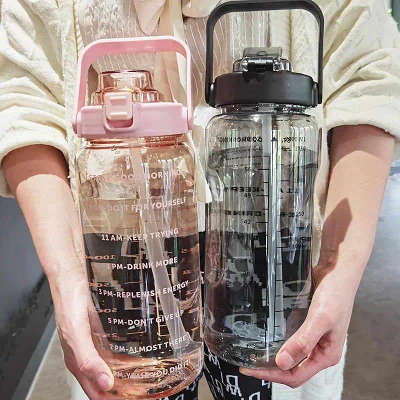 Fitness 2L portable bottle with straw, time markers for gym, running, and outdoor activities.