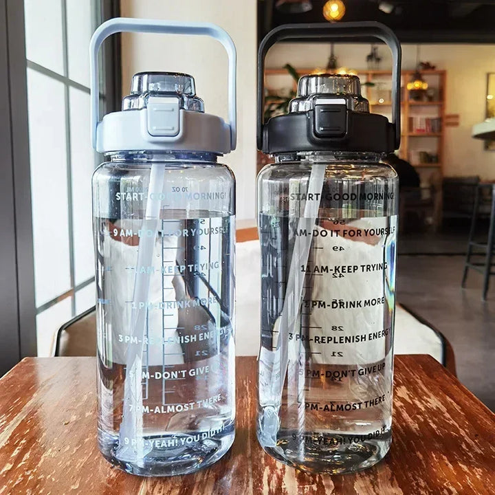 Unisex 2L water bottle, perfect for gym, outdoor, or office, with straw and time markers.