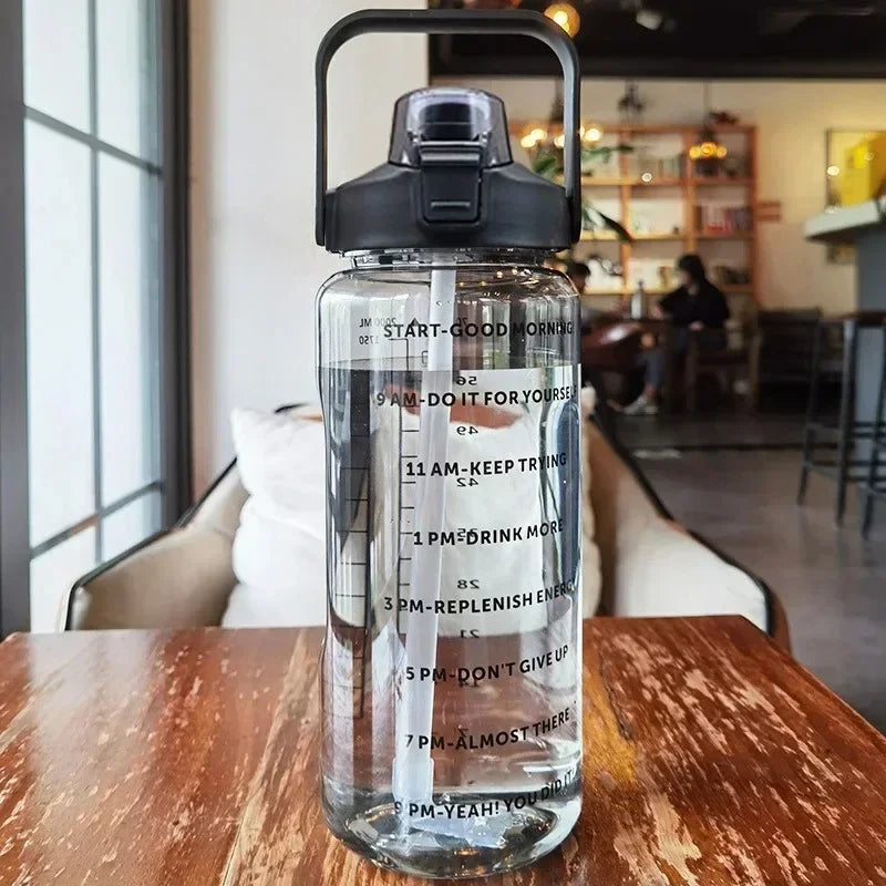 Portable 2-liter water bottle for active lifestyles, features straw & clear time tracking.