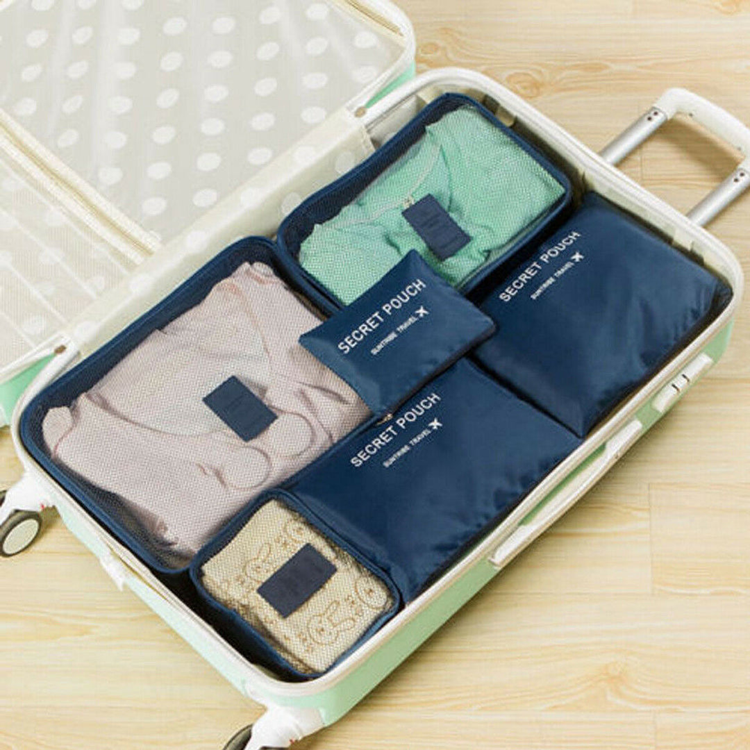 Two sets of travel packing cubes for organized luggage. Unisex space-saving storage bags.