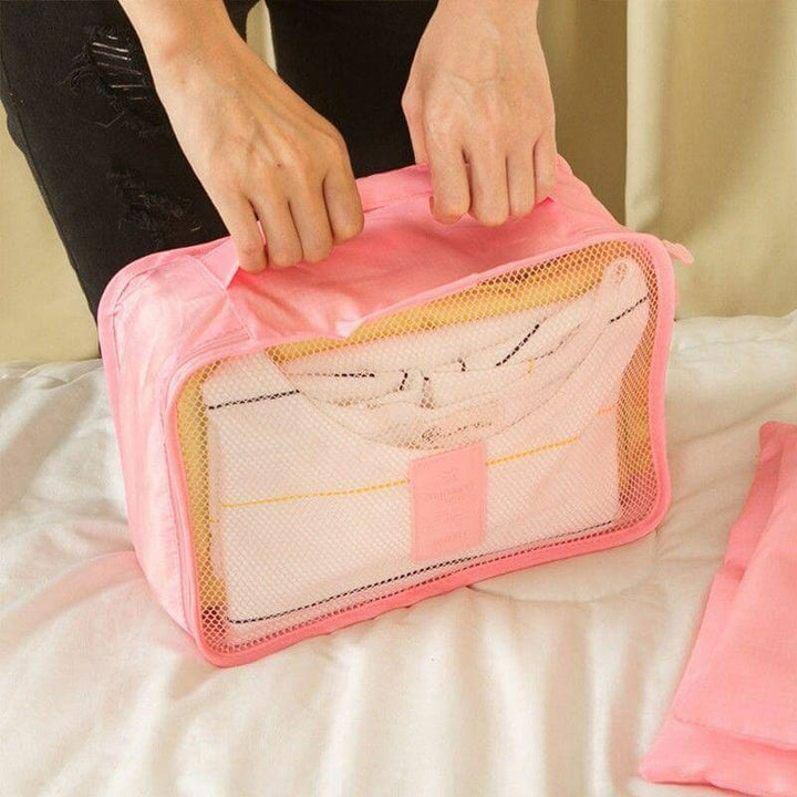 Get organized: Two 6-piece luggage packing organizer sets. Space-saving travel accessories.