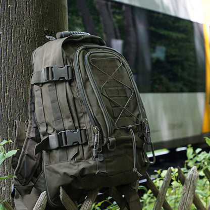Waterproof 60L tactical backpack in a forest setting, ready for outdoor adventure and hiking