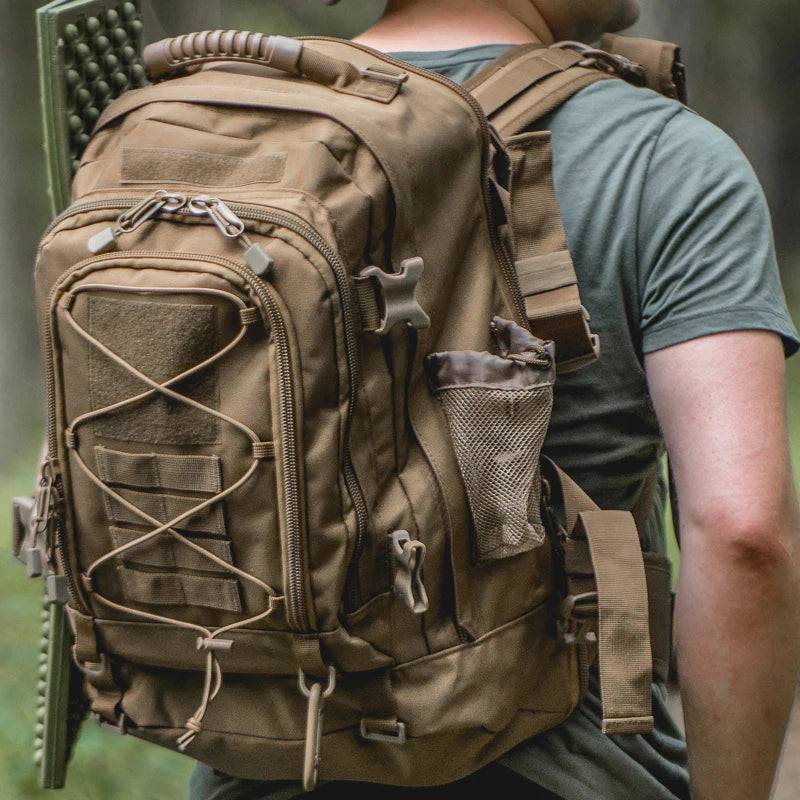 Model wearing a 65L tactical backpack outdoors, showcasing its comfortable fit and storage capacity