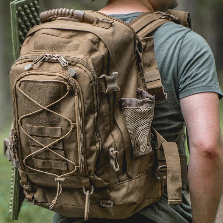 Model wearing a 65L tactical backpack outdoors, showcasing its comfortable fit and storage capacity