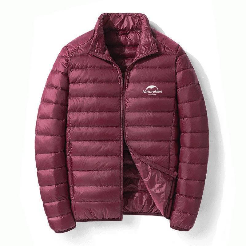Side view of model in lightweight 800FP duck down jacket, showcasing sleek outdoor gear design.