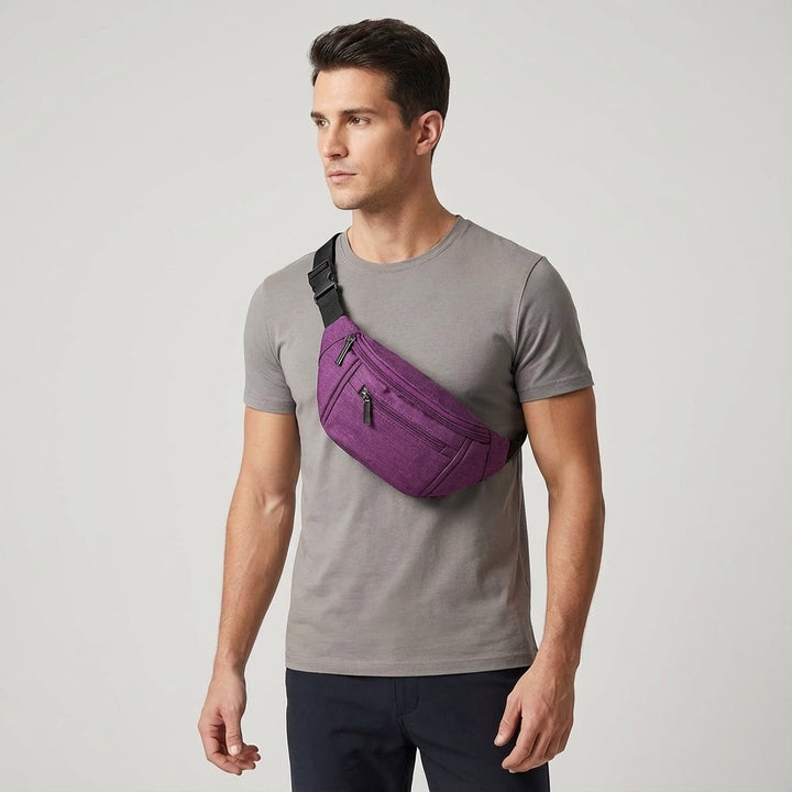 Unisex model wearing the adjustable black sling bag comfortably as a waist pack or crossbody for urban exploration.