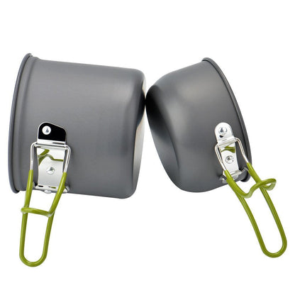 Portable camping cookware set with pots, pans, & utensils for outdoor cooking and travel gear.