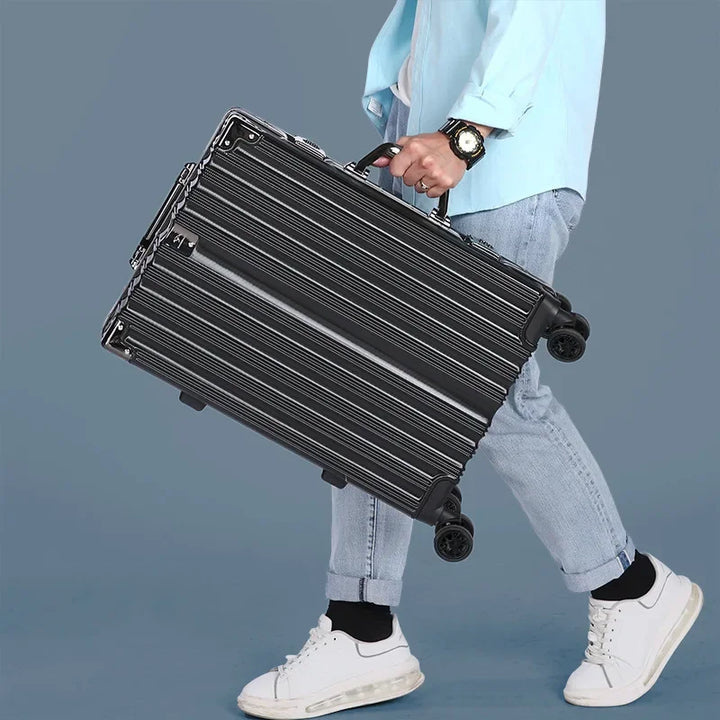 Modern aluminum frame hard-shell carry-on suitcase. Secure travel with spinner wheels.