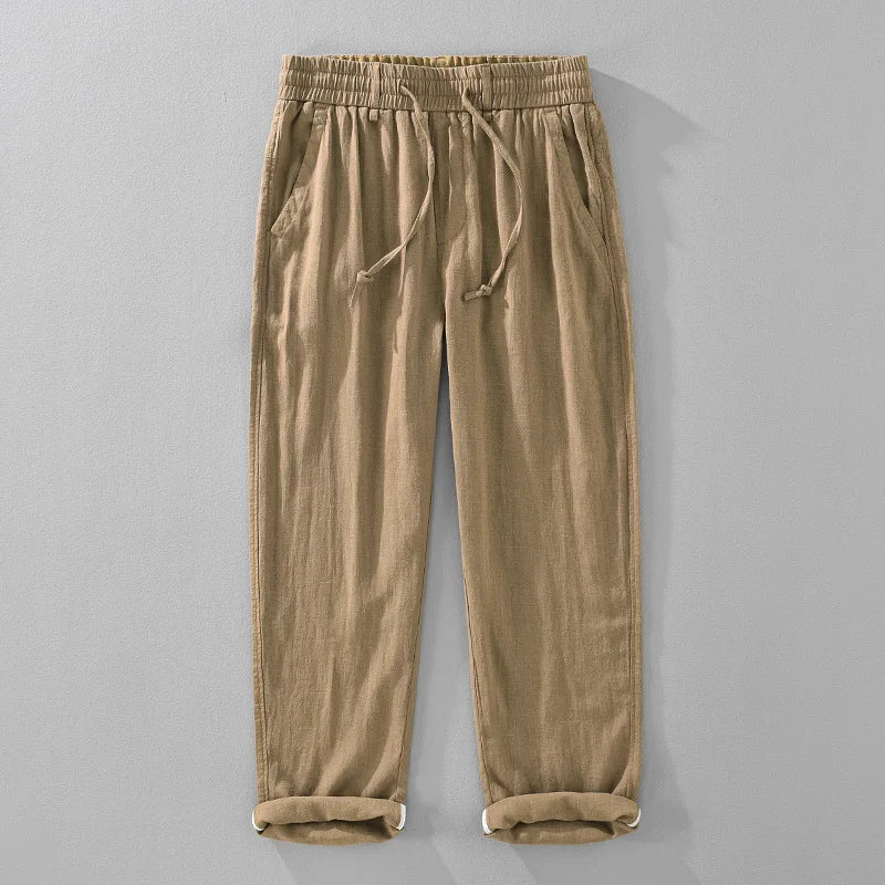 Versatile unisex drawstring pants with a relaxed fit, tapered leg, and rolled hem. Perfect for summer casual wear.
