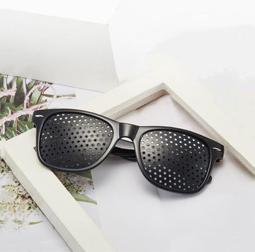 Vision care optical aid: anti-fatigue pinhole glasses for enhanced eye health.