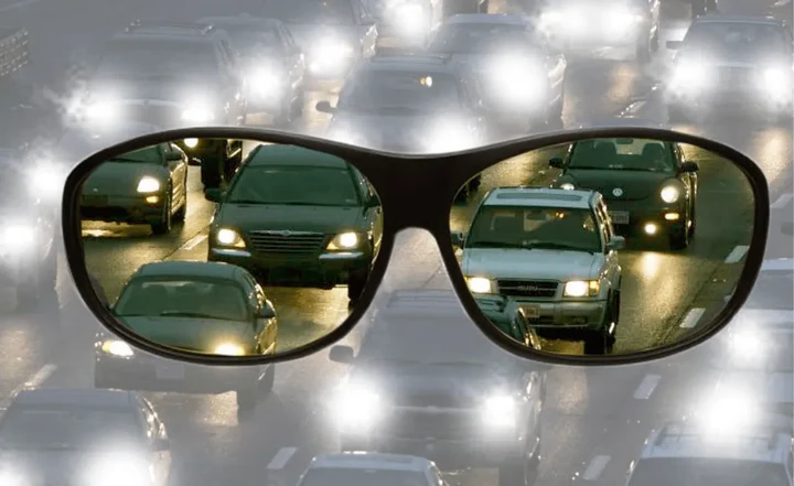 Yellow-tinted anti-glare driving glasses for improved night vision, road safety & headlight protection.