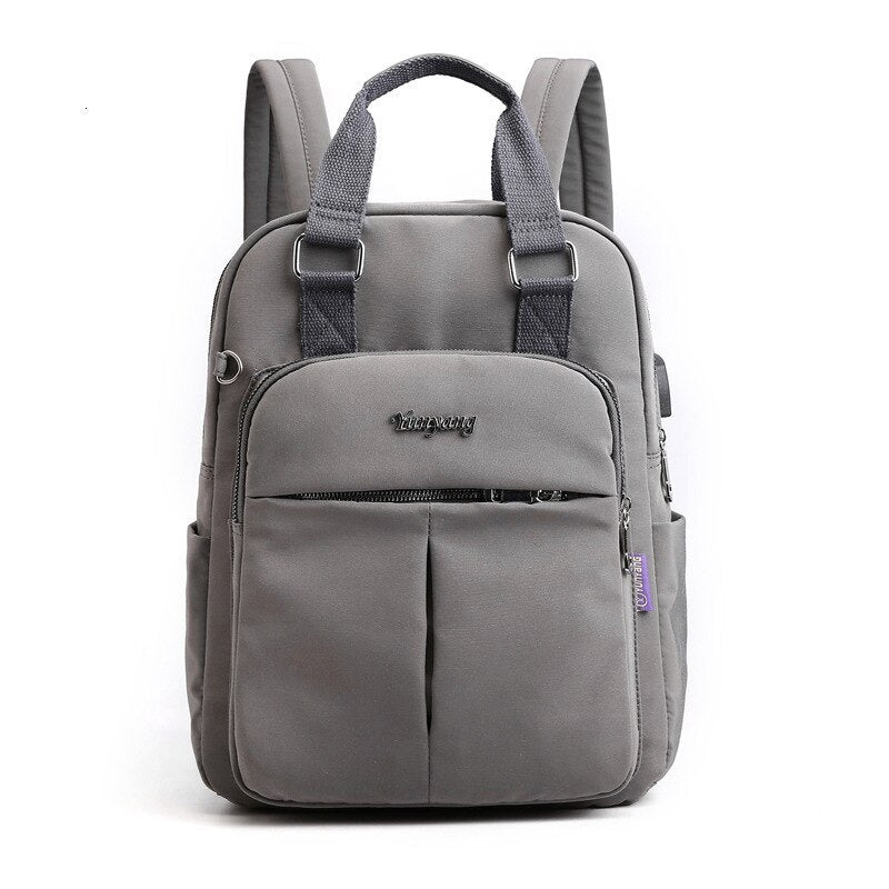 Multi-compartment USB charging backpack, ideal for students & commuters needing organized tech storage.