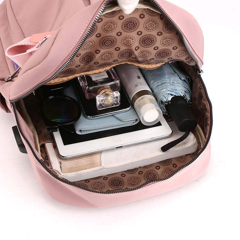 Organized multi-compartment anti-theft backpack, water-resistant with USB charging for students & professionals.