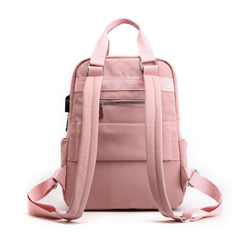 Stylish unisex anti-theft backpack, water-resistant & durable, featuring USB charging for modern commuters.