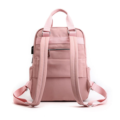 Stylish unisex anti-theft backpack, water-resistant & durable, featuring USB charging for modern commuters.