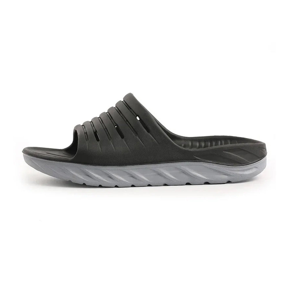Unisex arch support slides for plantar fasciitis & heel pain relief. Cushioned ergonomic footwear for daily wear comfort.