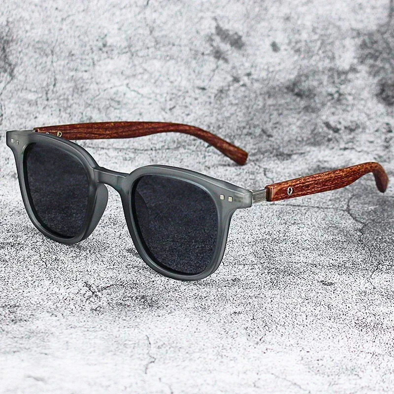 Stylish unisex Arden shades featuring durable wood-grain temples and gradient lenses for optimal sun protection.
