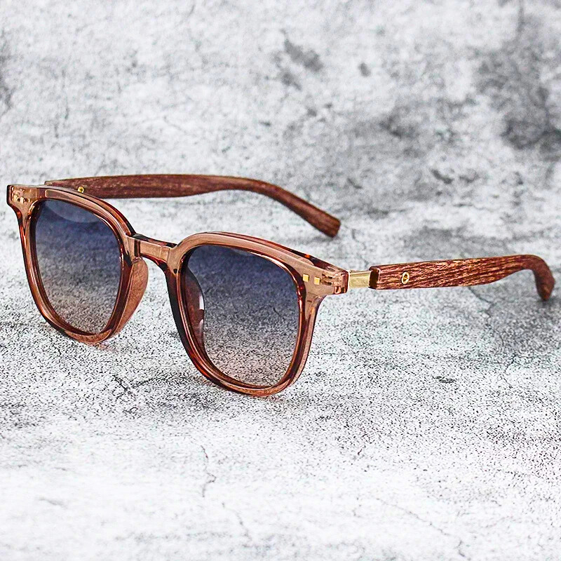 Trendy Arden unisex sunglasses with distinctive wood-grain temples, gradient lenses, and essential UV protection for stylish outdoor adventures.