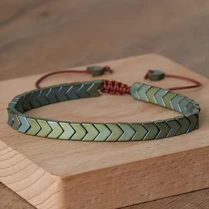Unisex Arrowline Hematite beaded bracelet featuring dark grey gemstone beads & adjustable design.