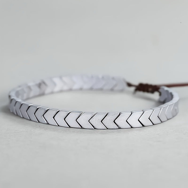 Chevron pattern hematite beaded bracelet, a stylish adjustable unisex accessory with dark grey gemstones.