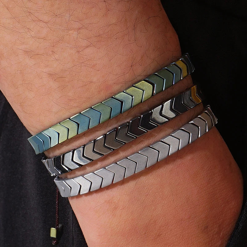 Close-up of Arrowline Hematite beaded bracelet, showcasing polished grey gemstone and detailed chevron pattern.