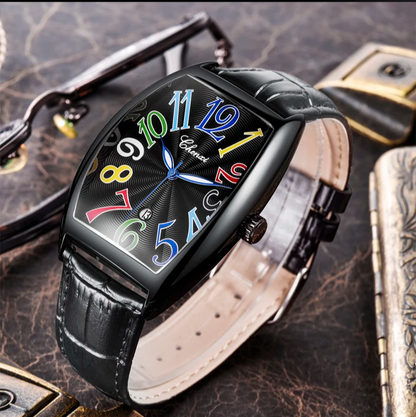 Leather strap dress watch in Art Deco style, featuring a sleek tonneau case and sunburst dial.