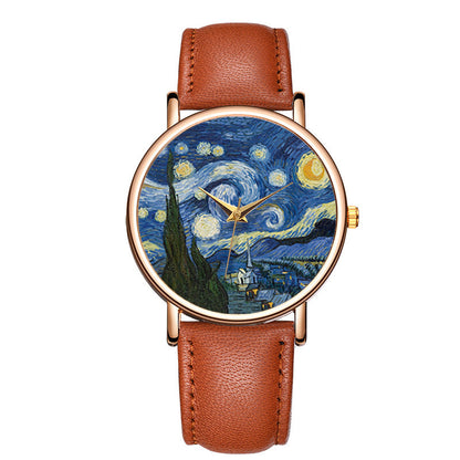 Close-up of a stylish unisex watch with an artistic impressionist dial and a classic brown leather strap.
