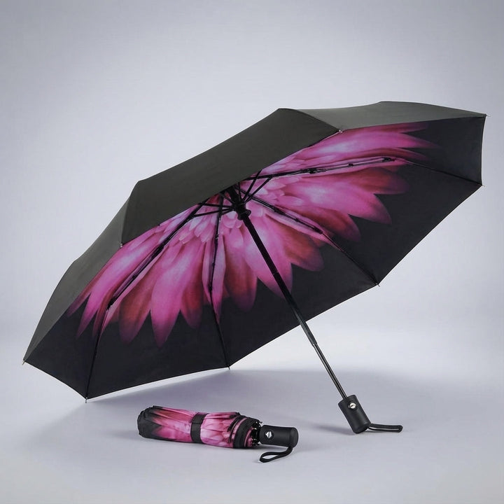 Rainova travel umbrella, folded & alongside luggage, emphasizing its portability & compact design.