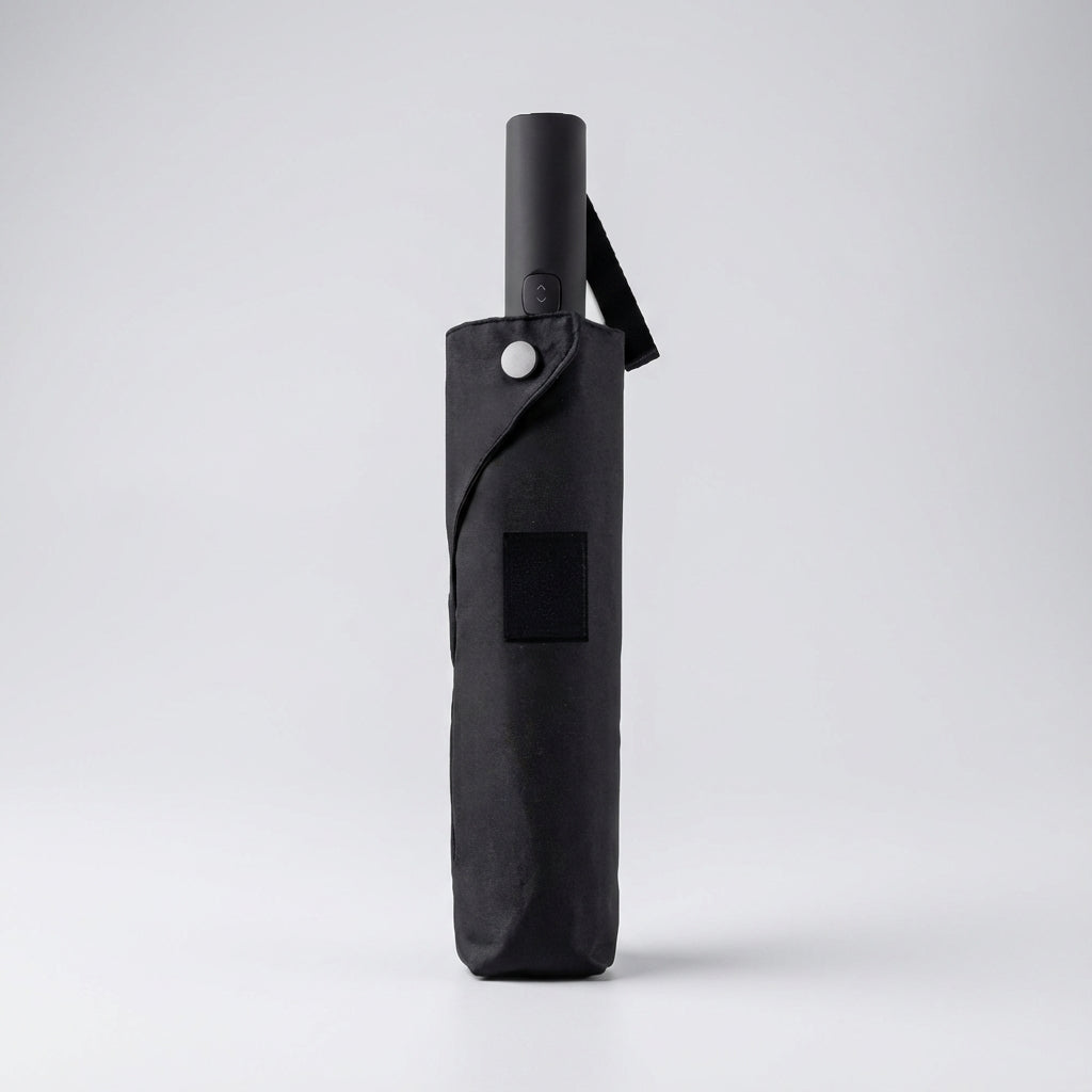 Compact windproof & water-repellent automatic travel umbrella, essential portable rain gear for outdoor adventures.