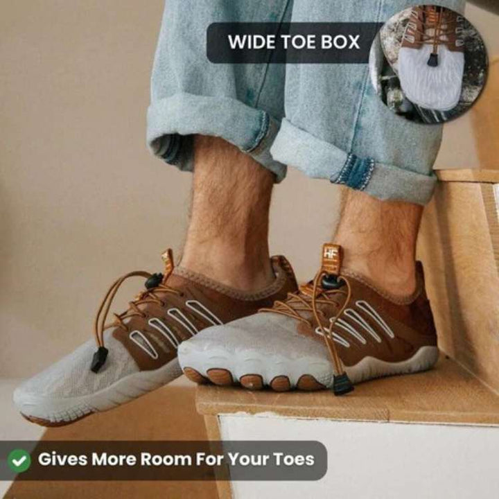 Pair of unisex barefoot hiking shoes on a trail, highlighting the flexible, non-slip sole