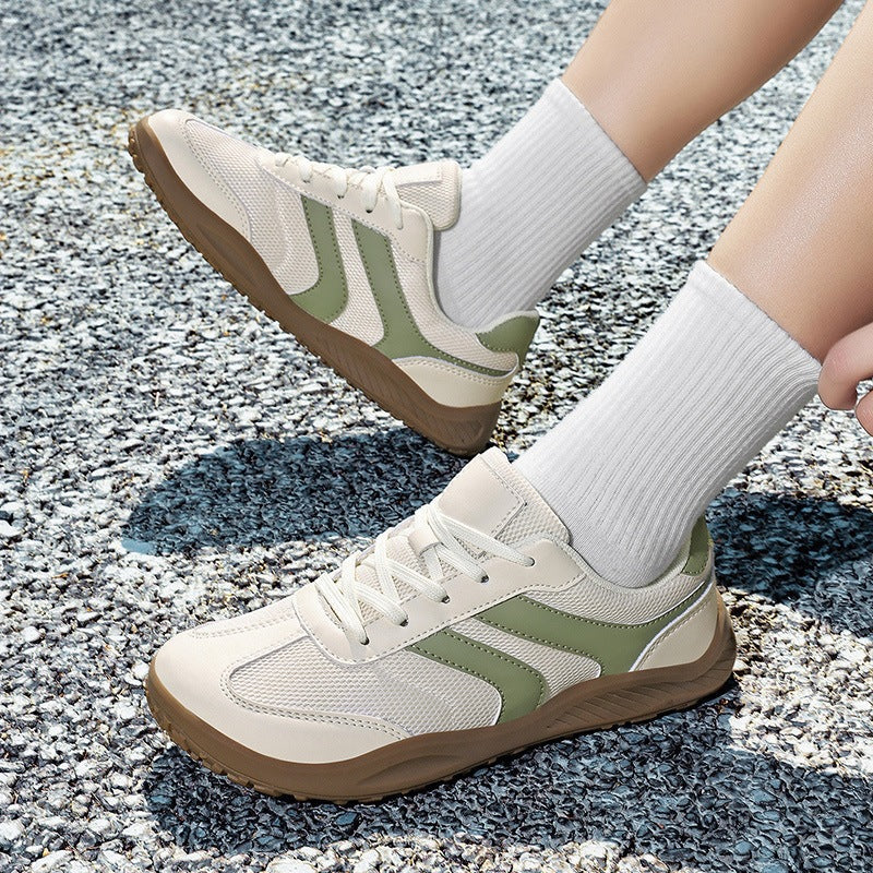 Side profile of unisex barefoot walking shoe, showcasing flexible sole & wide toe box for natural movement.