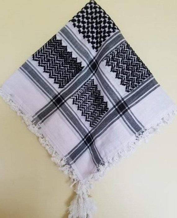 Traditional black and white keffiyeh shemagh worn as a head wrap, made of soft cotton