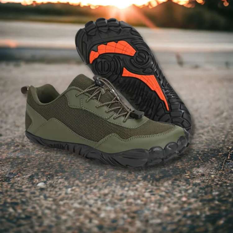 Minimalist black barefoot activewear shoes on a person's feet, ready for hiking and outdoor activities.
