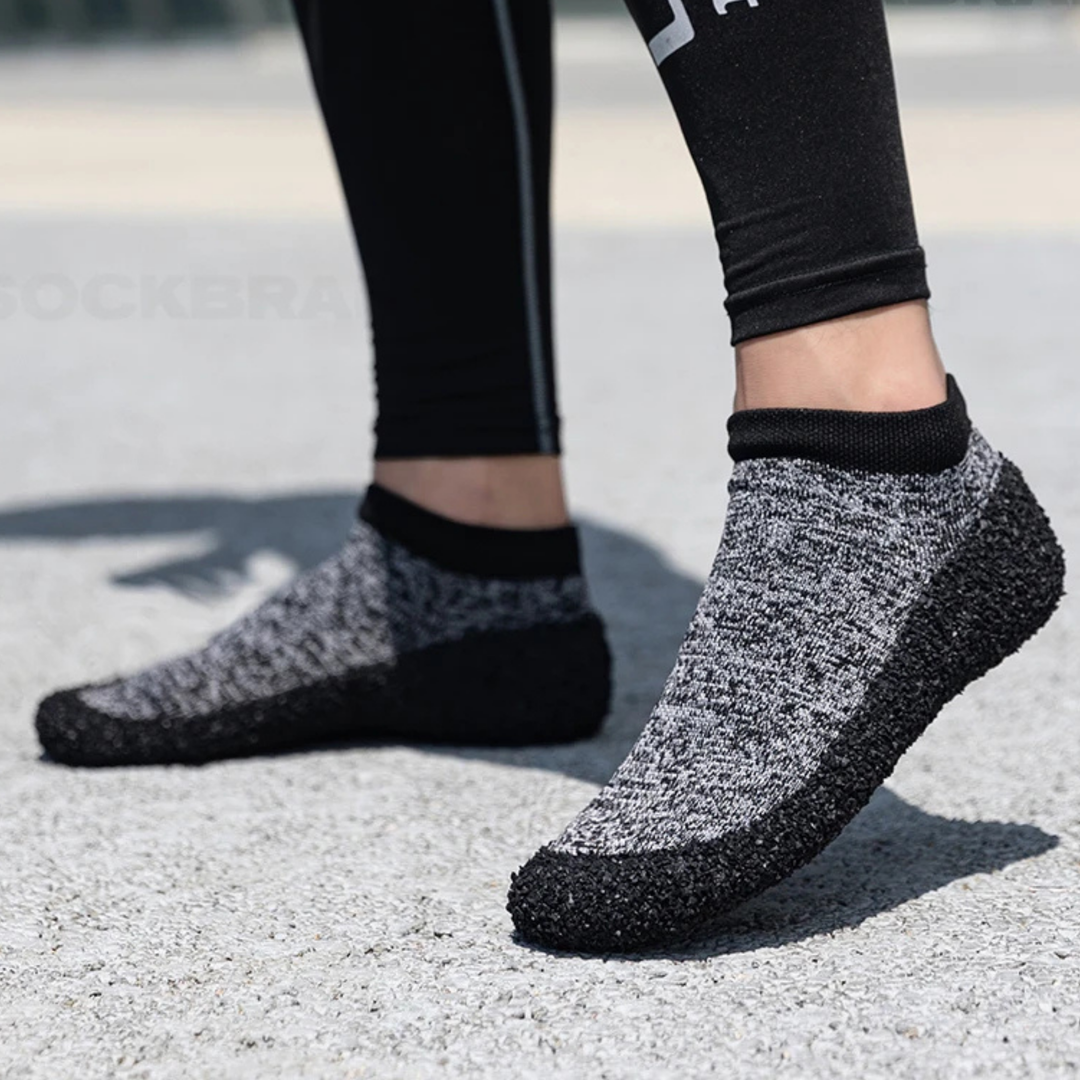 Unisex barefoot sock shoes in a vibrant red, featuring flexible material for natural foot movement and comfort