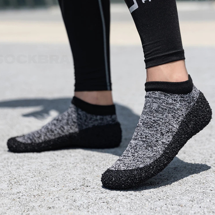 Unisex barefoot sock shoes in a vibrant red, featuring flexible material for natural foot movement and comfort
