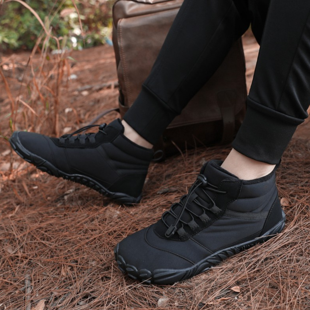 Black winter barefoot footwear, water resistant and flexible, perfect for cold weather treks.