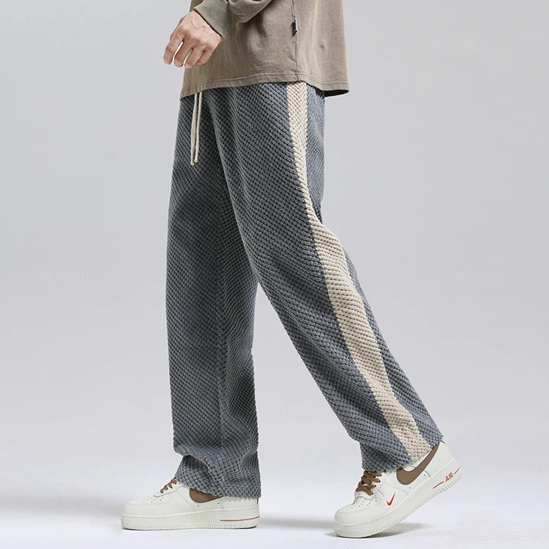 Unisex black corduroy pants, relaxed fit for everyday comfort & style.