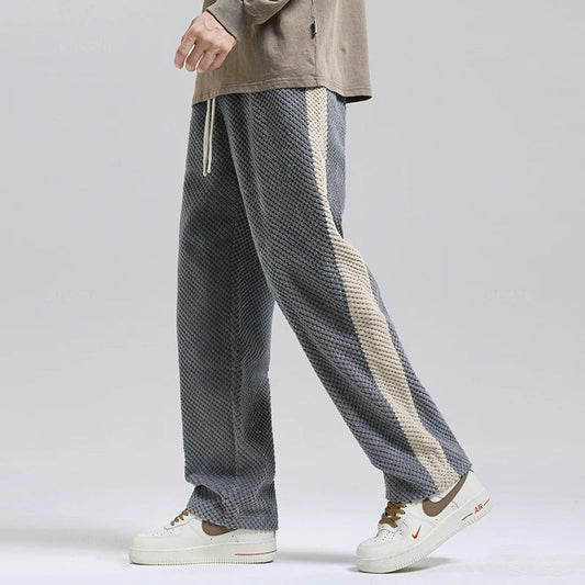 Unisex black corduroy pants, relaxed fit for everyday comfort & style.