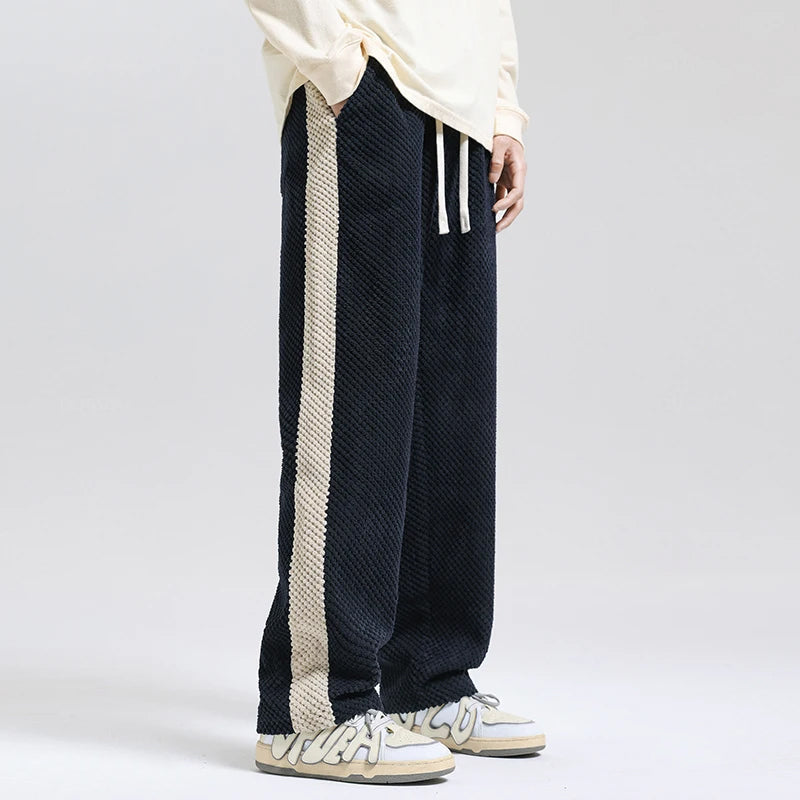 Stylish grey unisex corduroy pants, comfortable for casual everyday wear.