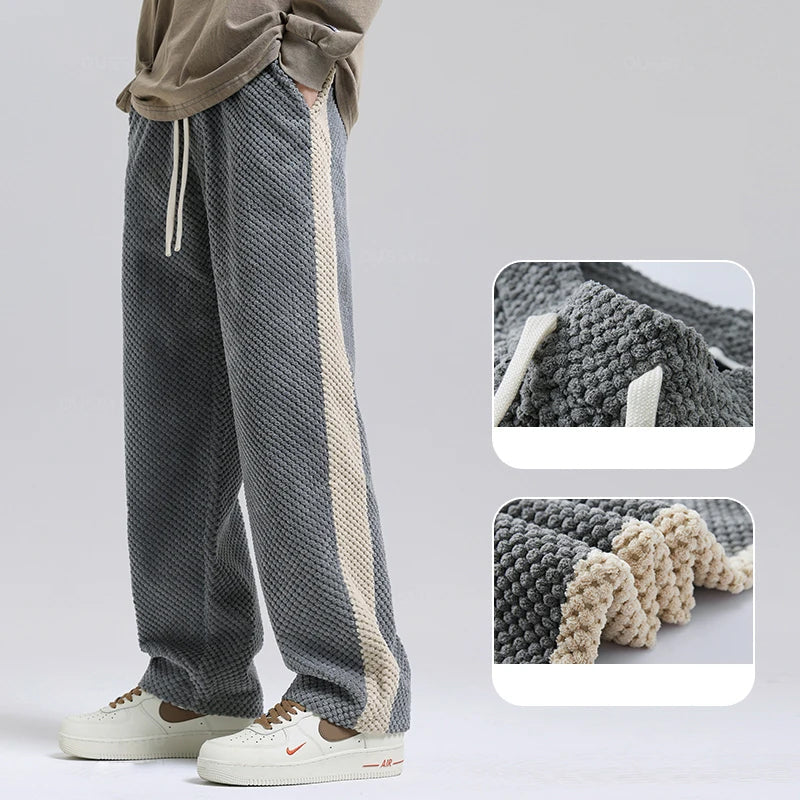 Versatile unisex grey corduroy pants, perfect for comfortable and stylish everyday wear.