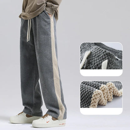 Versatile unisex grey corduroy pants, perfect for comfortable and stylish everyday wear.