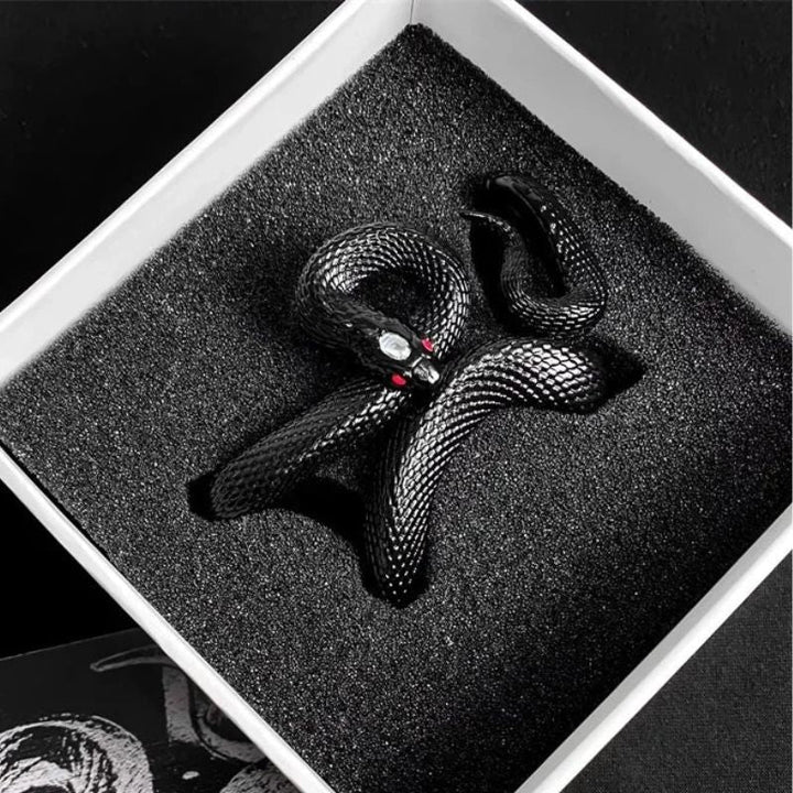Unisex serpent design earbud charging case in pink silicone, provides scratch-resistant protection.