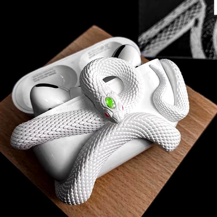 Unique tech accessory: a white silicone earbud case with an eye-catching serpent design, scratch protection.