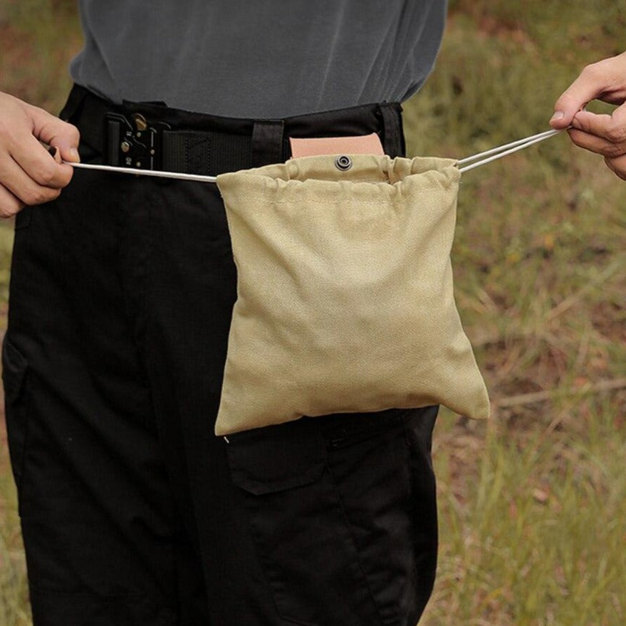 Interior view of a travel fanny pack, revealing organized compartments for various accessories
