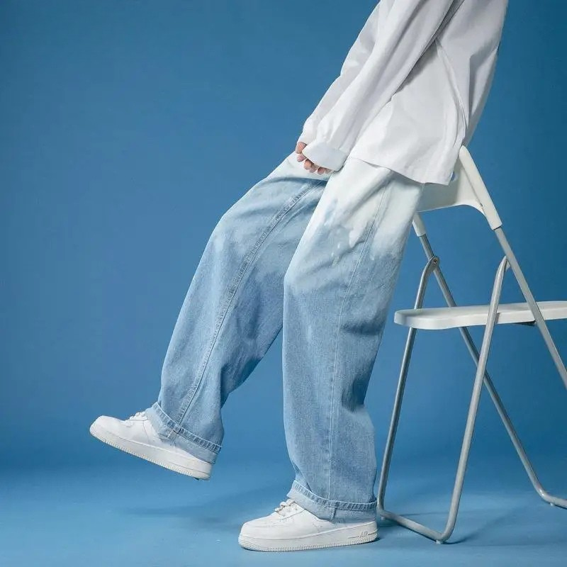 Unisex bleach-dye wide-leg fade jeans with a bold, streetwear style. Relaxed fit for comfortable wear.