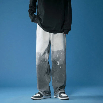 Stylish wide-leg fade jeans with a striking bleach-dye finish, offering a comfortable, relaxed fit for all.