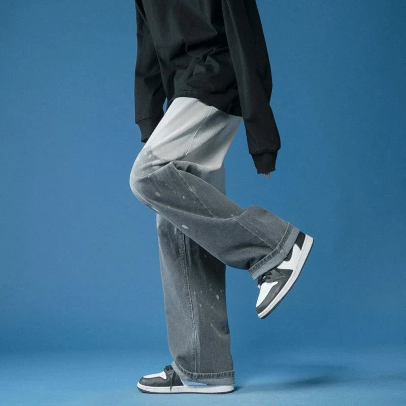 Comfortable unisex wide-leg jeans with a unique bleach-dye effect and stylish fade, perfect for a relaxed fit.